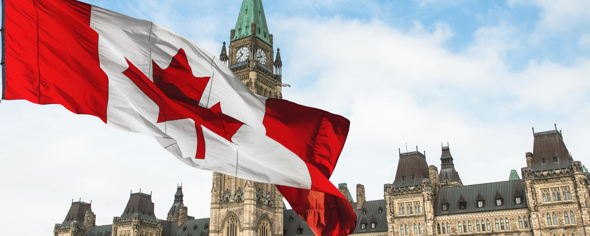 parliament buildings in ottawa ontario with canada flag.
