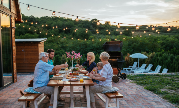 family sitting at a picnic table