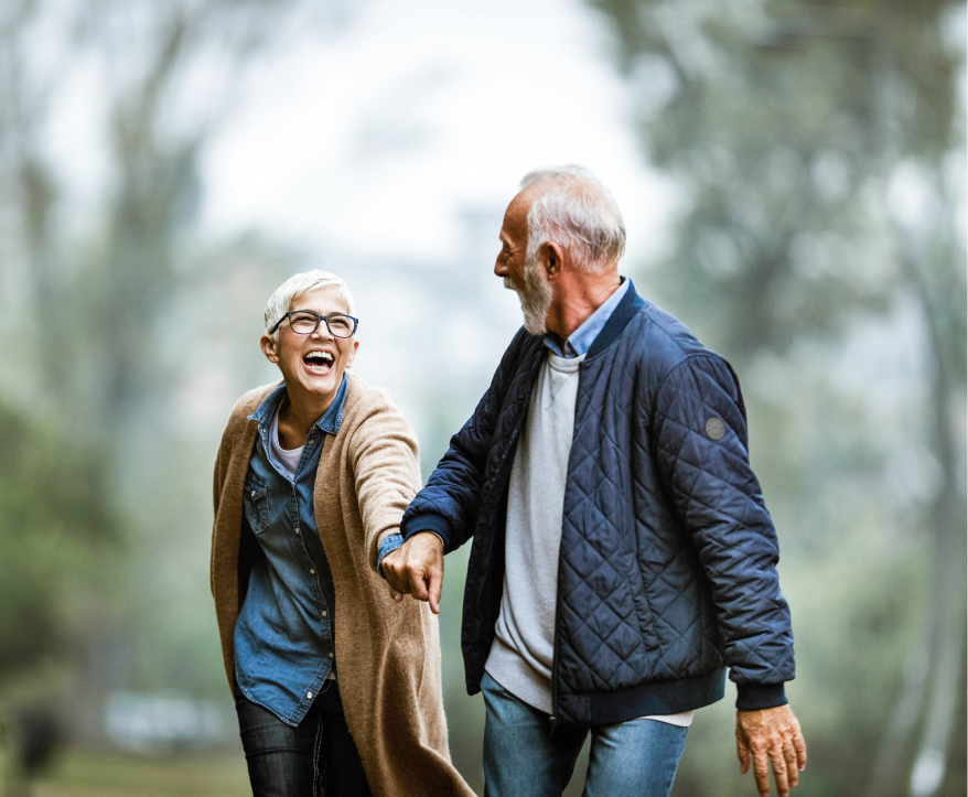 Man and woman holding hands while hiking