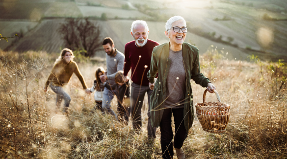 family of six walking through a field