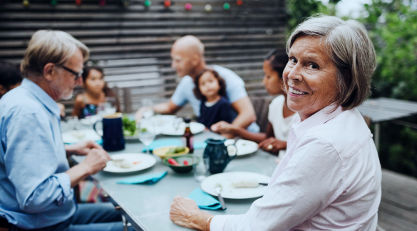 family sitting around a picnic table