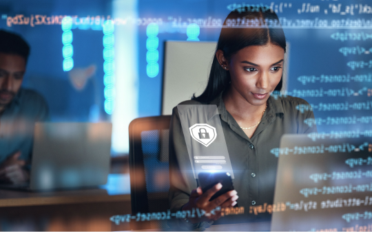woman looking at computer screen with code overlayed on top