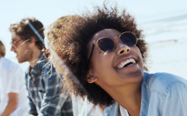 woman wearing sunglasses and smiling