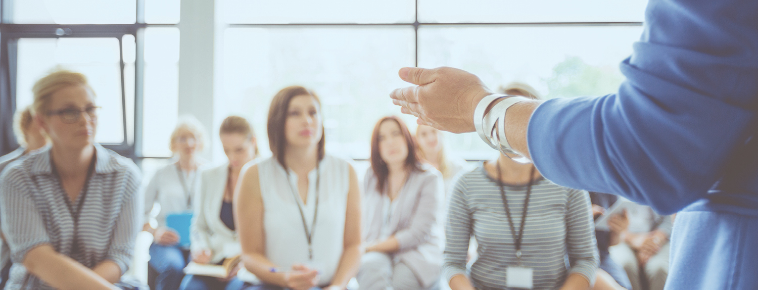 speaker presenting to a group of women