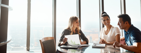 three people in a meeting