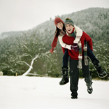 couple playing in the snow