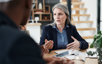mature woman speaking to people