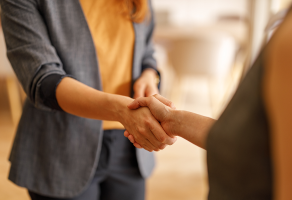 two people shake hands