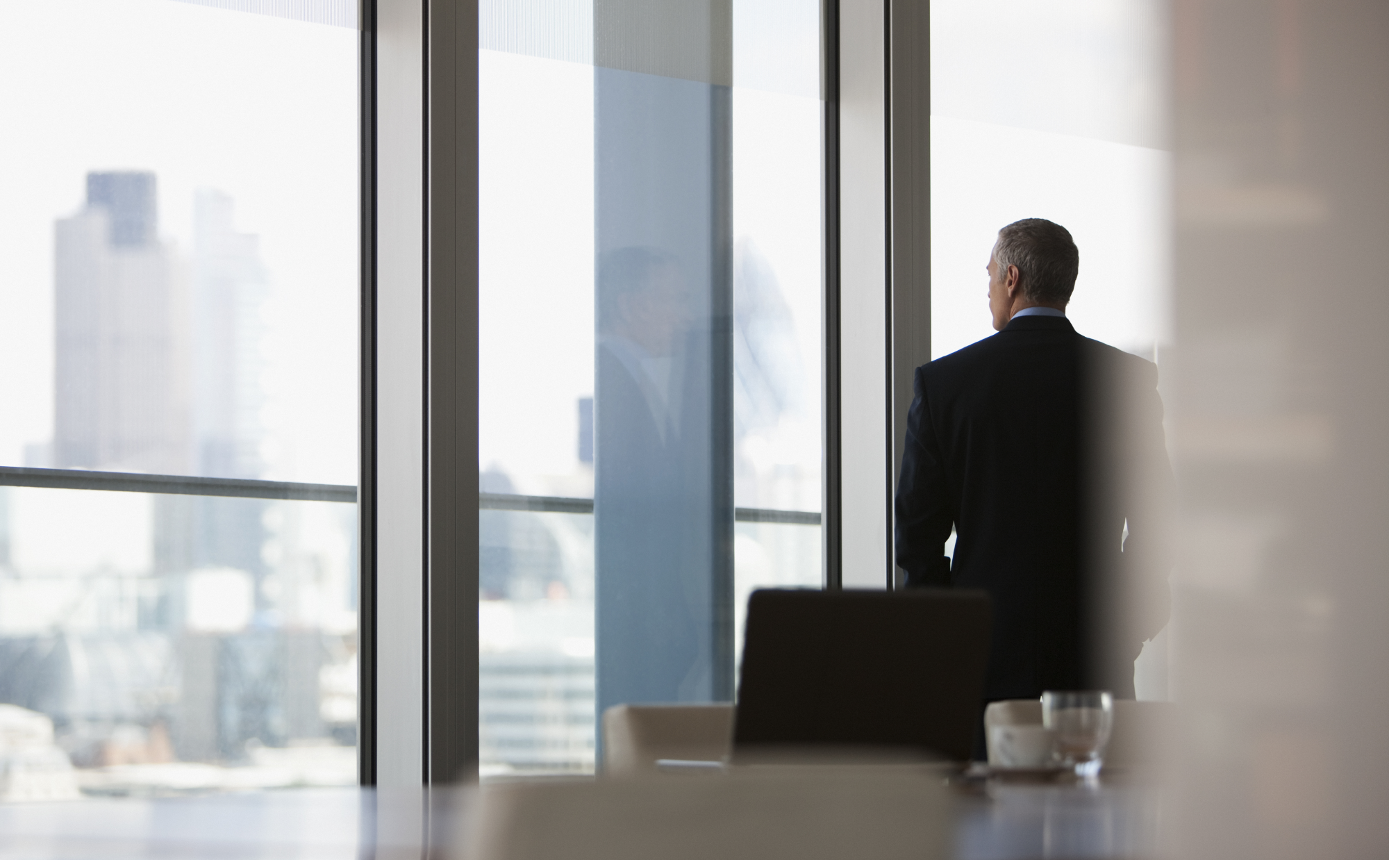 man in suit standing my window